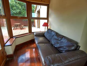 Sun room with leather sofa